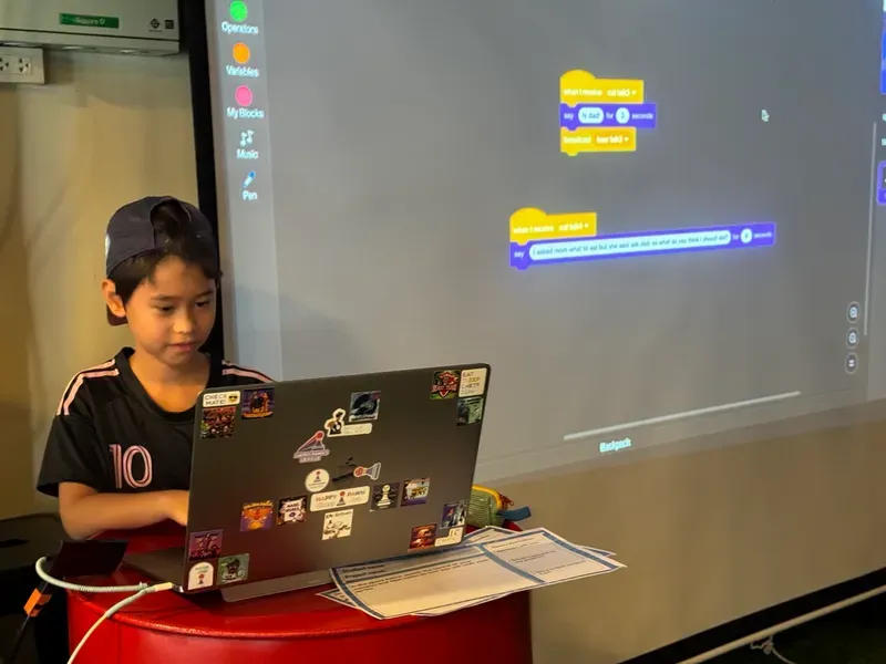 Student presenting their coding project to the class at Little Geek Academy