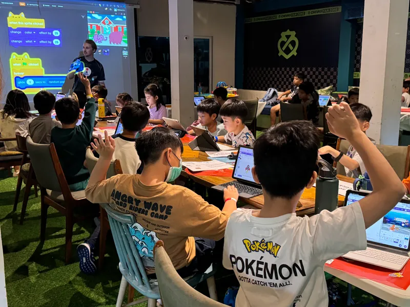 Kids building Scratch games during a Little Geek Academy coding class